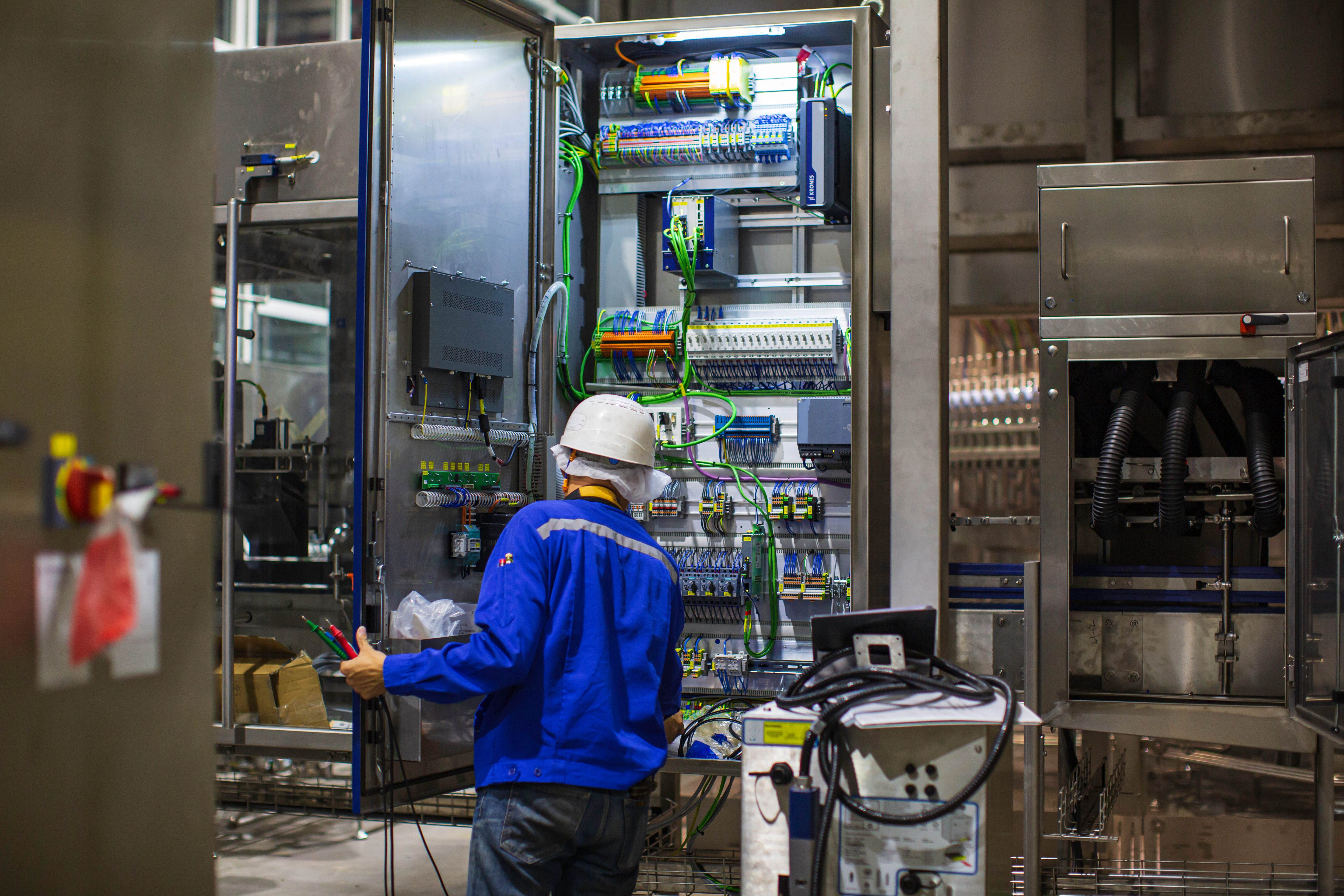 Electrician engineer tests electrical box control
